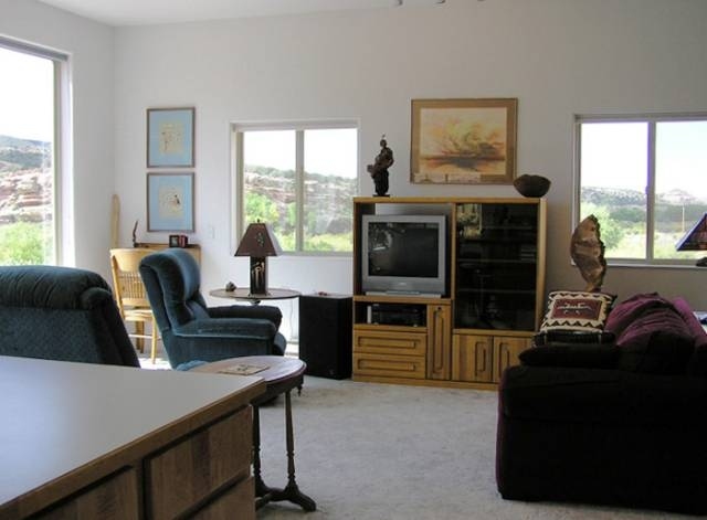 12665 G Road Cortez, CO 81321 - Photo 4 of 9 a living room with furniture large window and flat screen tv