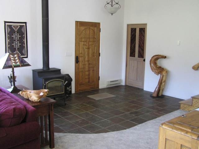 12665 G Road Cortez, CO 81321 - Photo 5 of 9 a bedroom with a bed and a mirror