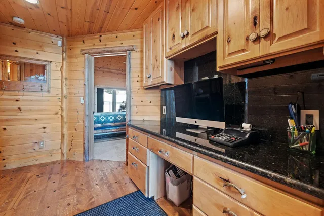 a kitchen with stainless steel appliances a stove and a microwave