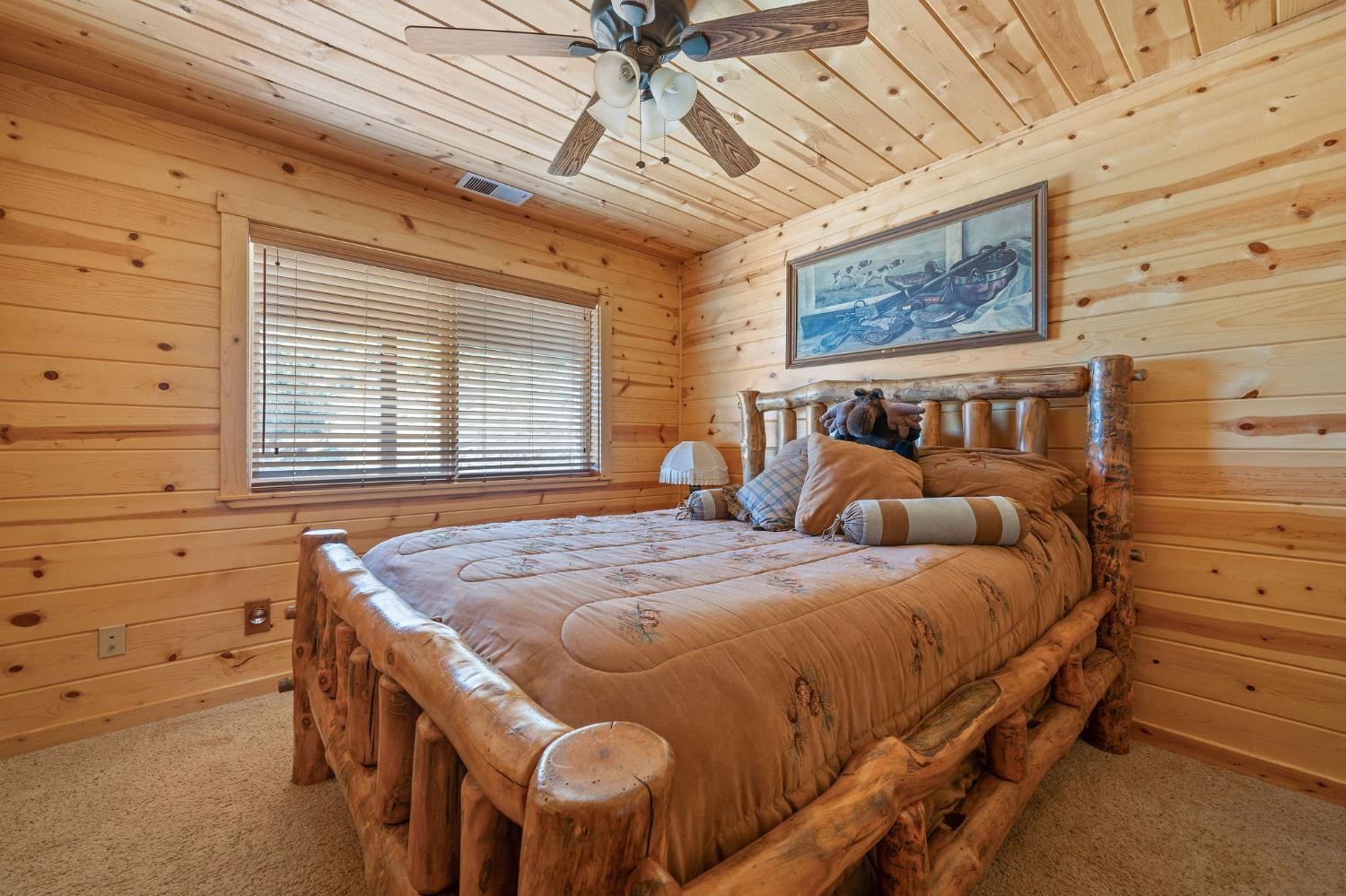 6800 West Murray Creek Road San Andreas, CA 95249 - Photo 21 of 47 a bedroom with a bed and a table