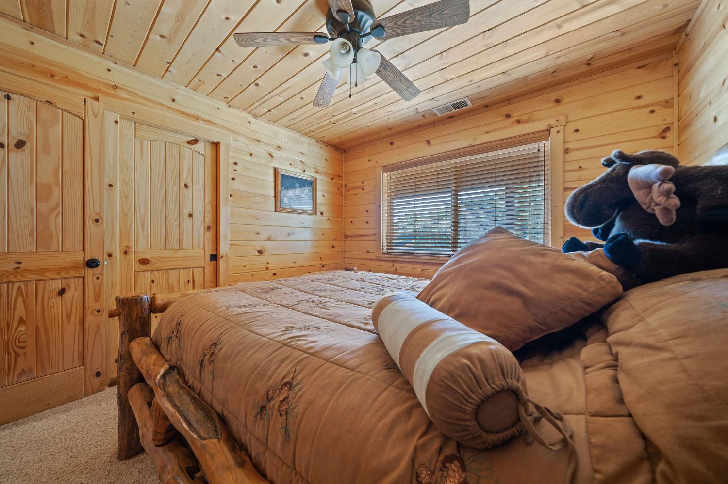 6800 West Murray Creek Road San Andreas, CA 95249 - Photo 24 of 47 a bedroom with a bed and a window