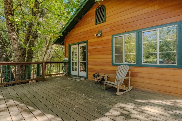 a view of a house with wooden deck