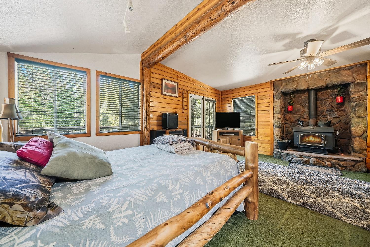 6800 West Murray Creek Road San Andreas, CA 95249 - Photo 40 of 47 a bedroom with a bed and a flat screen tv