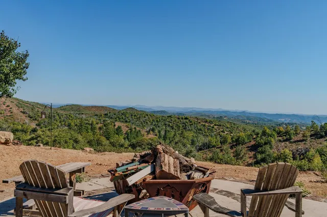 a view of a balcony with furniture