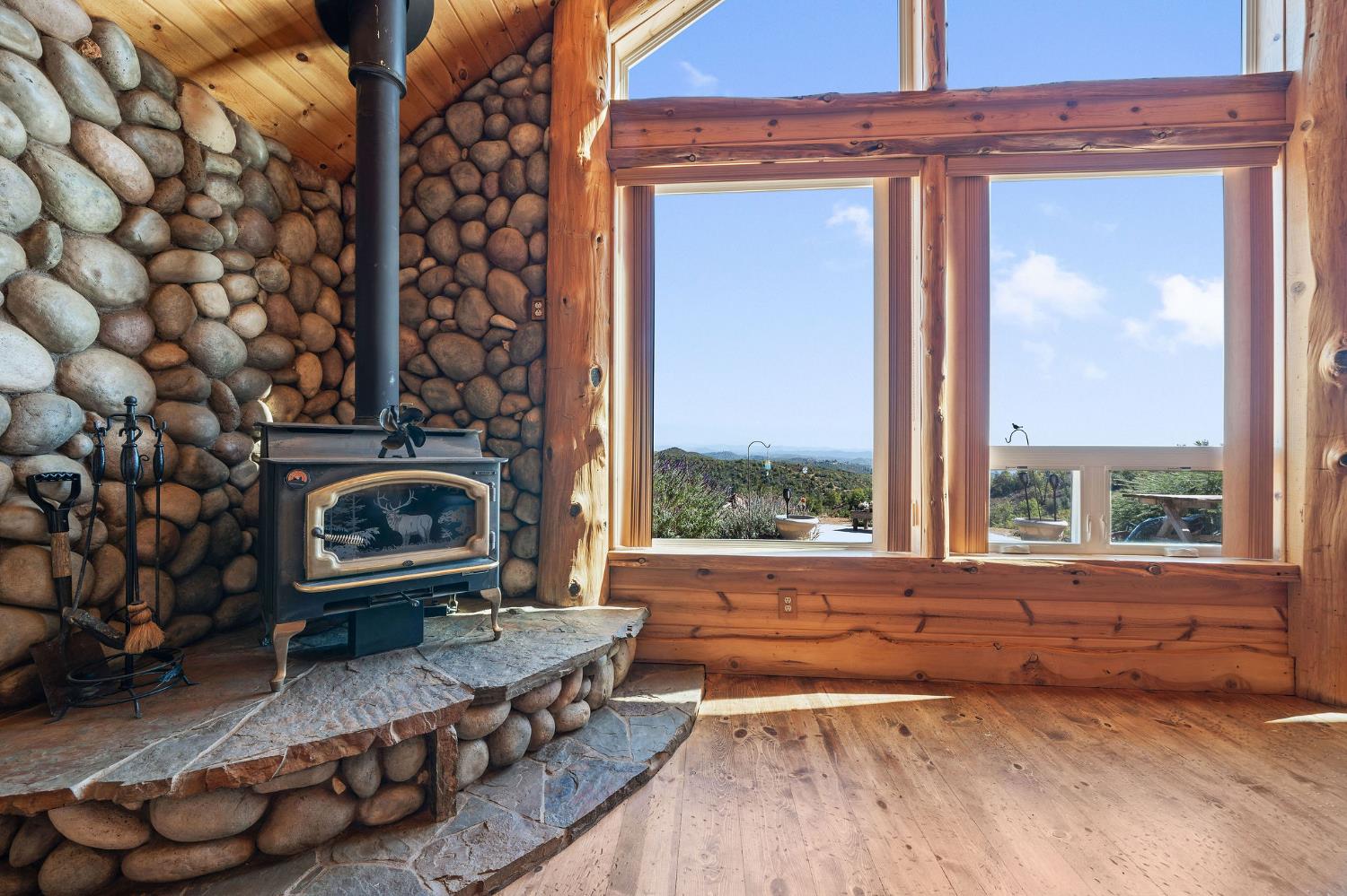 6800 West Murray Creek Road San Andreas, CA 95249 - Photo 5 of 47 a living room with furniture and a fireplace