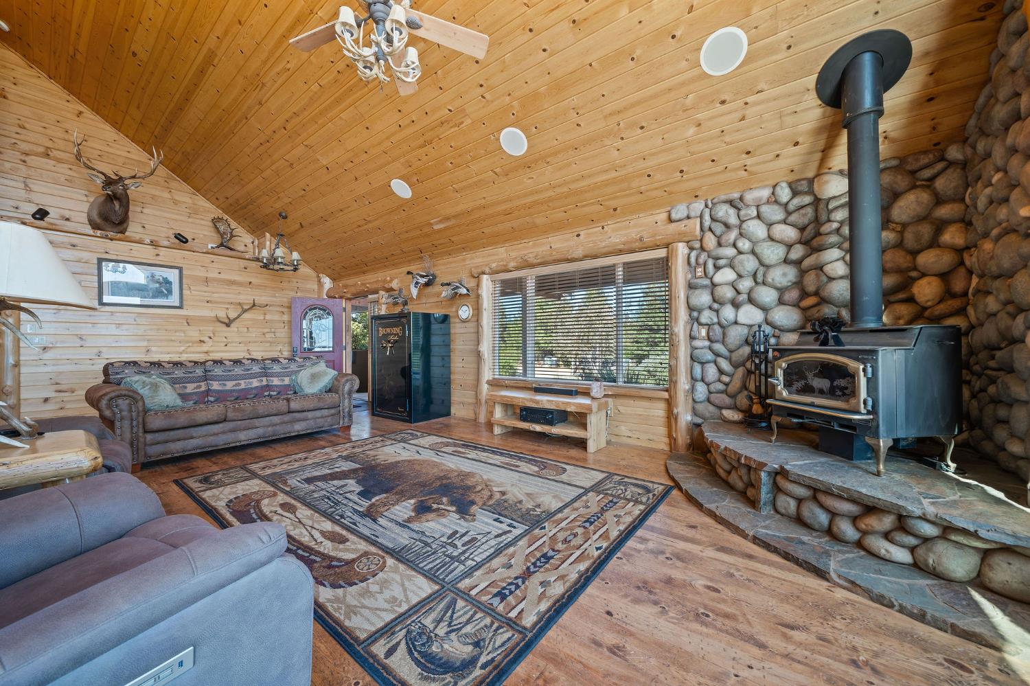 6800 West Murray Creek Road San Andreas, CA 95249 - Photo 7 of 47 a living room with furniture and a fireplace