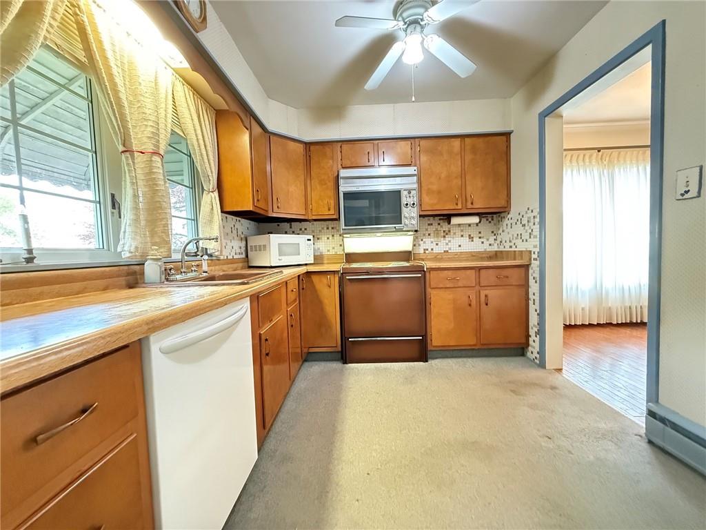 123 Hadley Road Greenville, PA 16125 - Photo 28 of 49 a kitchen with stainless steel appliances granite countertop a sink and a stove