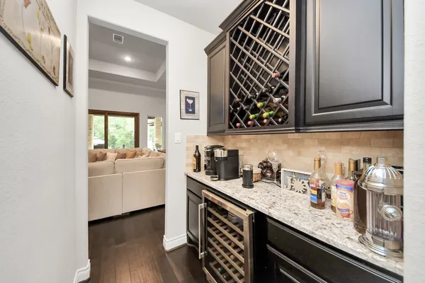 a kitchen with sink and cabinets