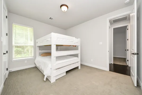 a work room with furniture and a large window