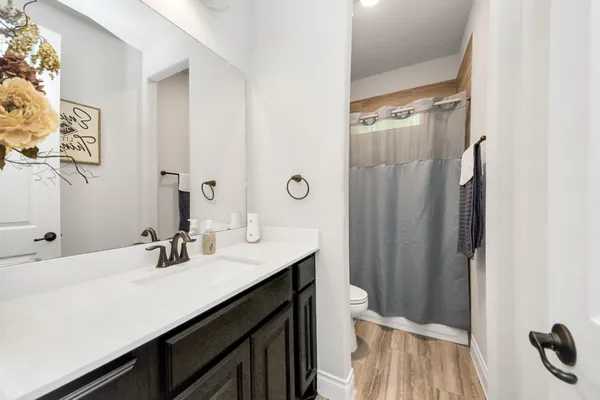 a view of a livingroom with furniture and flat screen tv