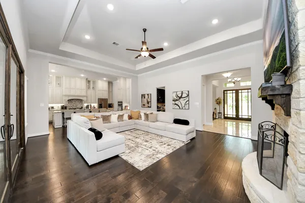 a living room with furniture fireplace and flat screen tv