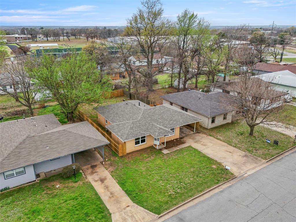732 Bullock Street Denison, TX 75020 - Photo 27 of 29 an aerial view of a house with a yard