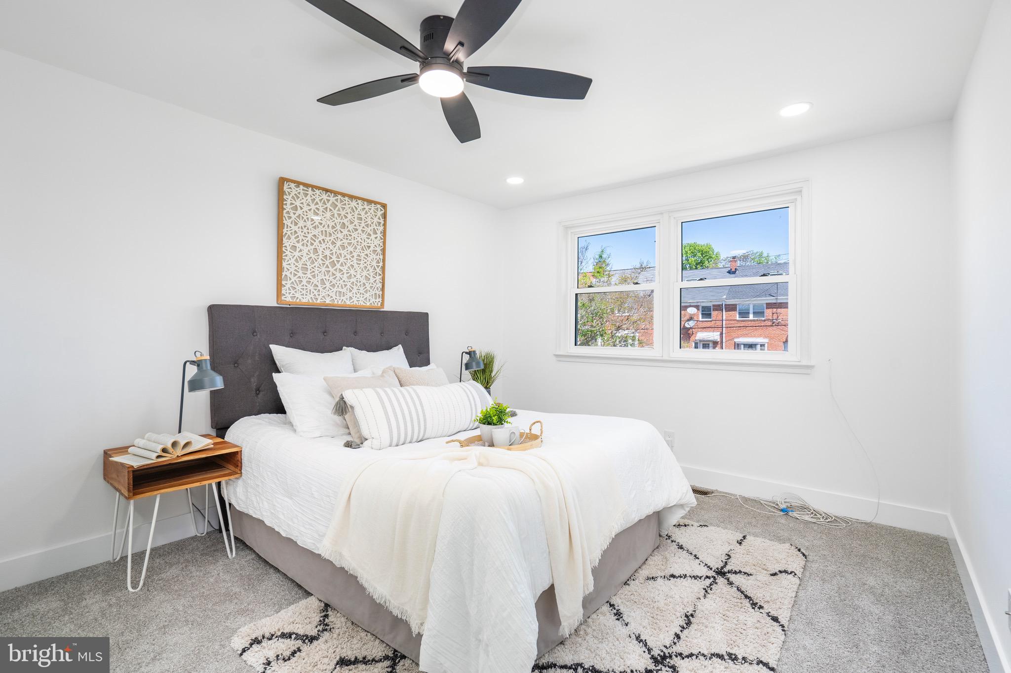 1808 Winford Road Baltimore, MD 21239 - Photo 20 of 39 a bedroom with a bed and a painting on the wall