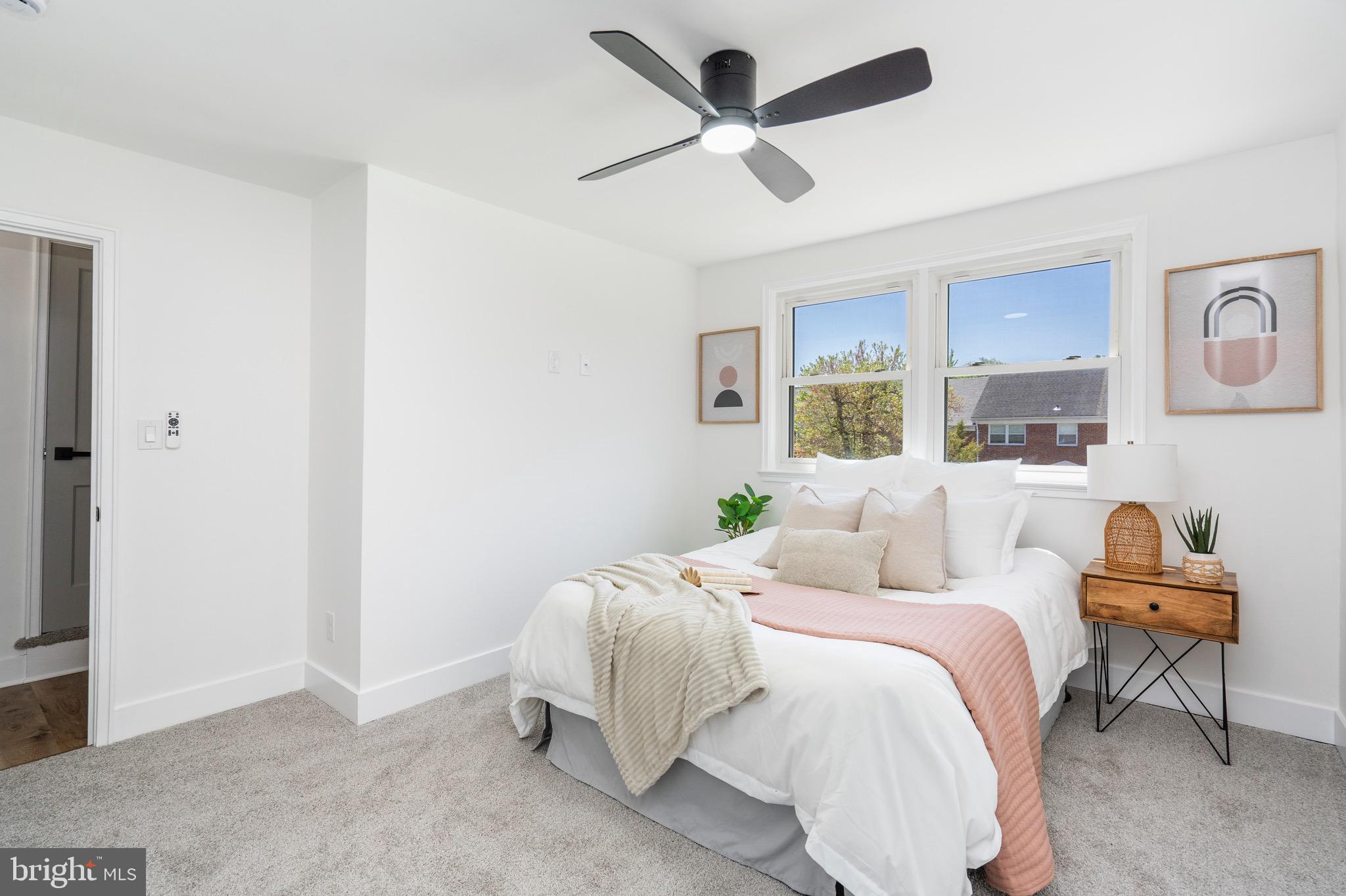 1808 Winford Road Baltimore, MD 21239 - Photo 22 of 39 a bedroom with a bed and a chandelier
