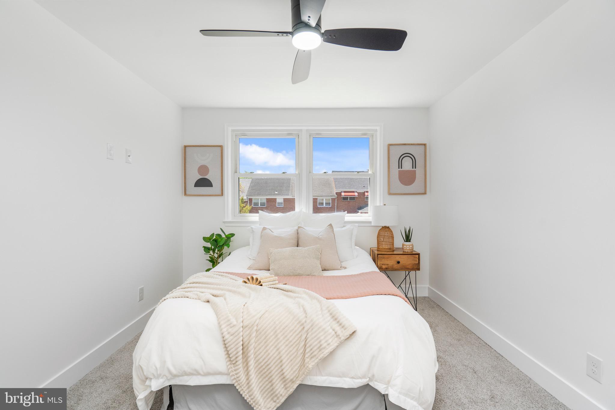 1808 Winford Road Baltimore, MD 21239 - Photo 23 of 39 a bedroom with a bed and ceiling fan