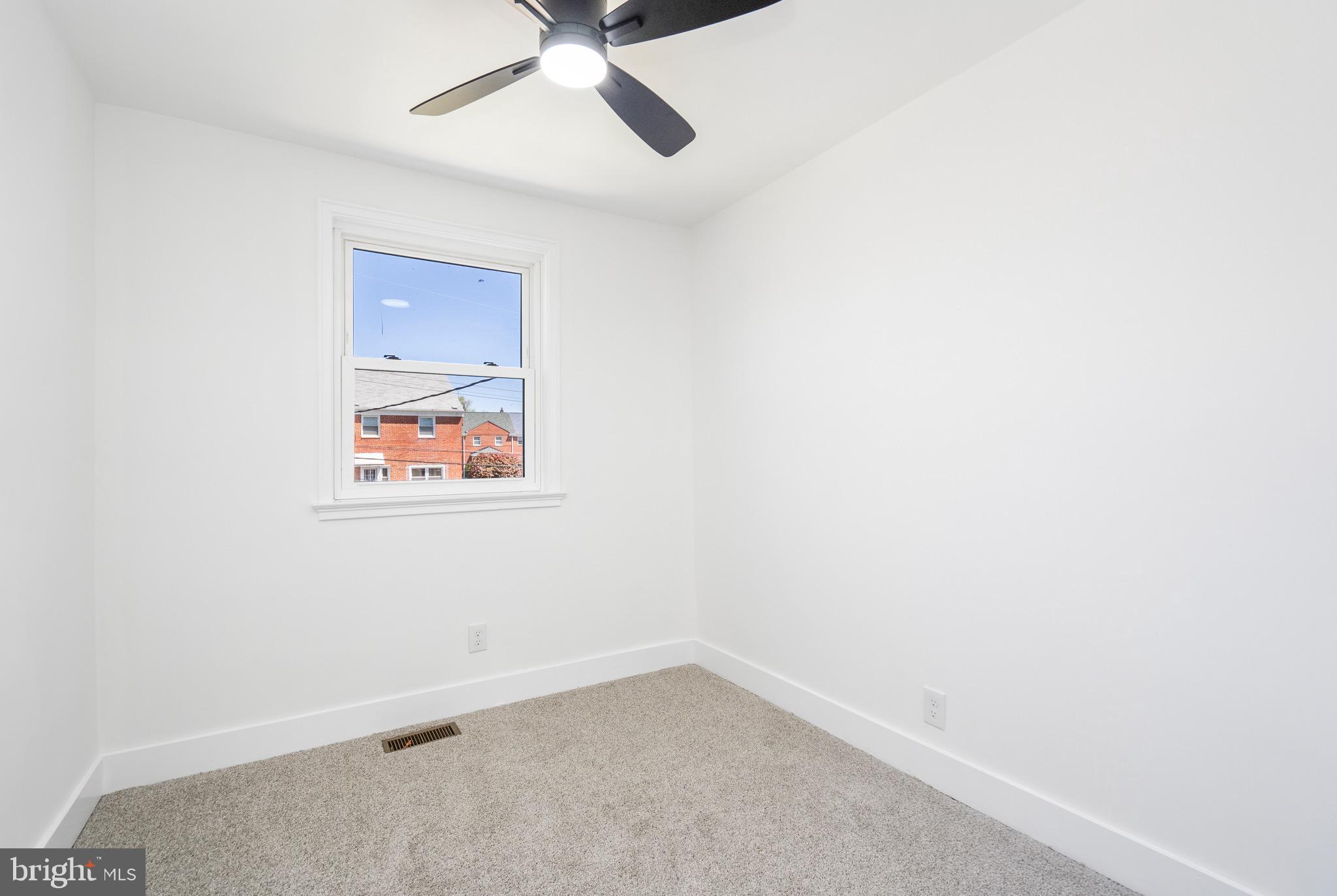 1808 Winford Road Baltimore, MD 21239 - Photo 25 of 39 an empty room with a window and ceiling fan