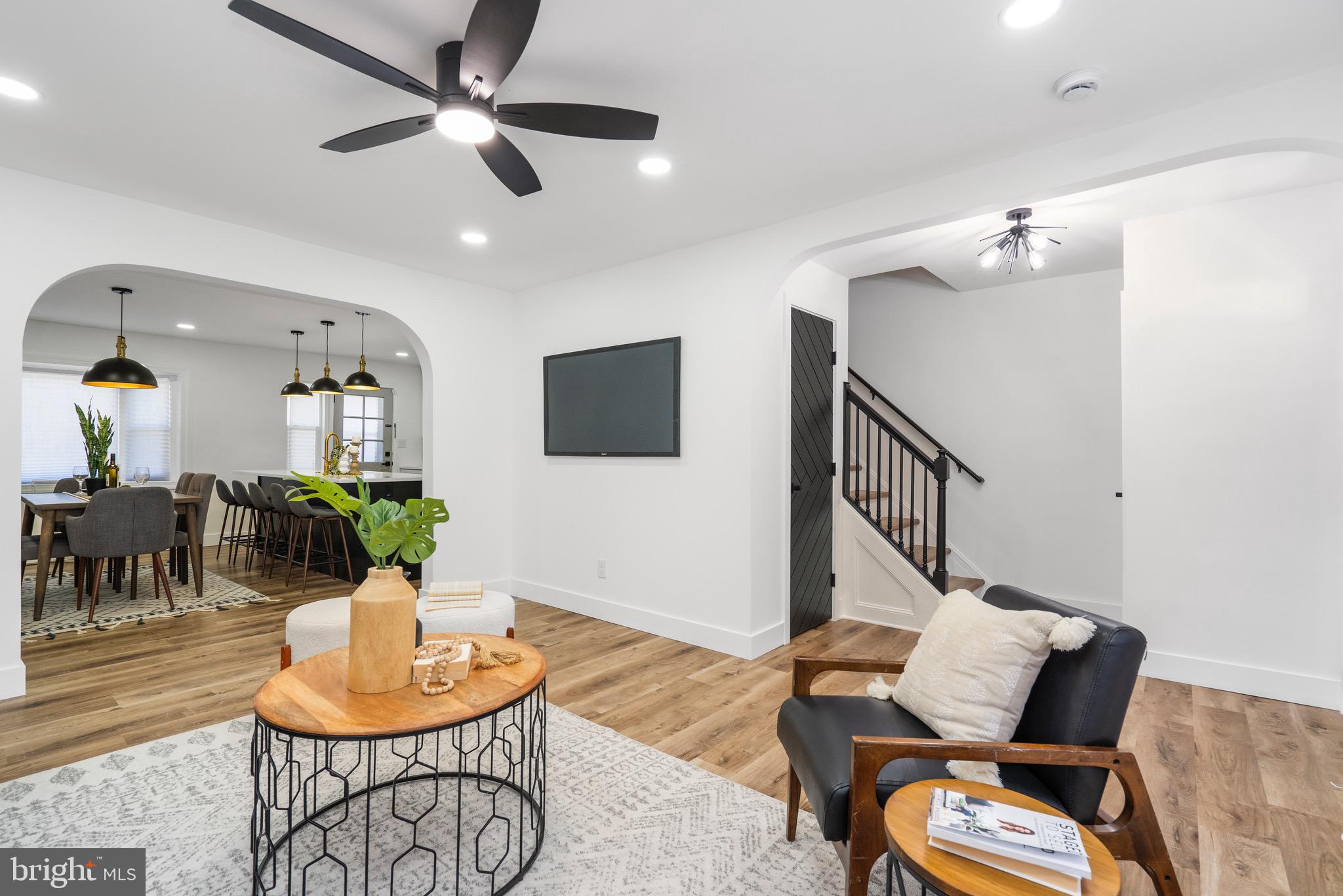 1808 Winford Road Baltimore, MD 21239 - Photo 3 of 39 a living room with furniture and a chandelier