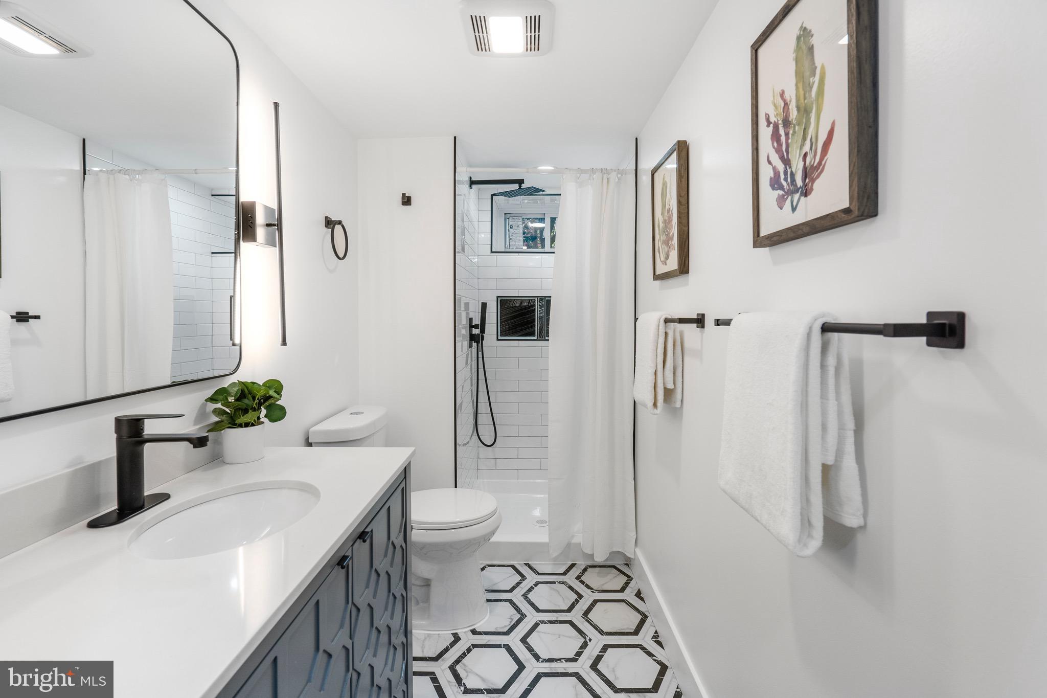 1808 Winford Road Baltimore, MD 21239 - Photo 33 of 39 a bathroom with a sink toilet and shower