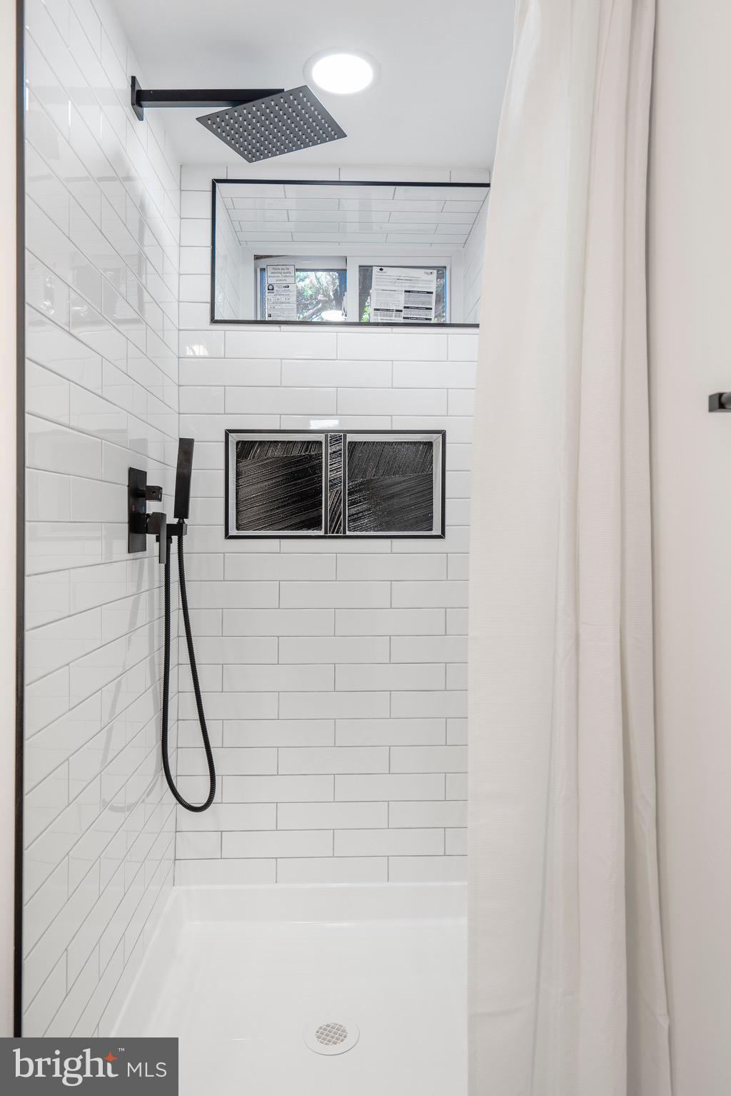 1808 Winford Road Baltimore, MD 21239 - Photo 35 of 39 a bathroom with a shower
