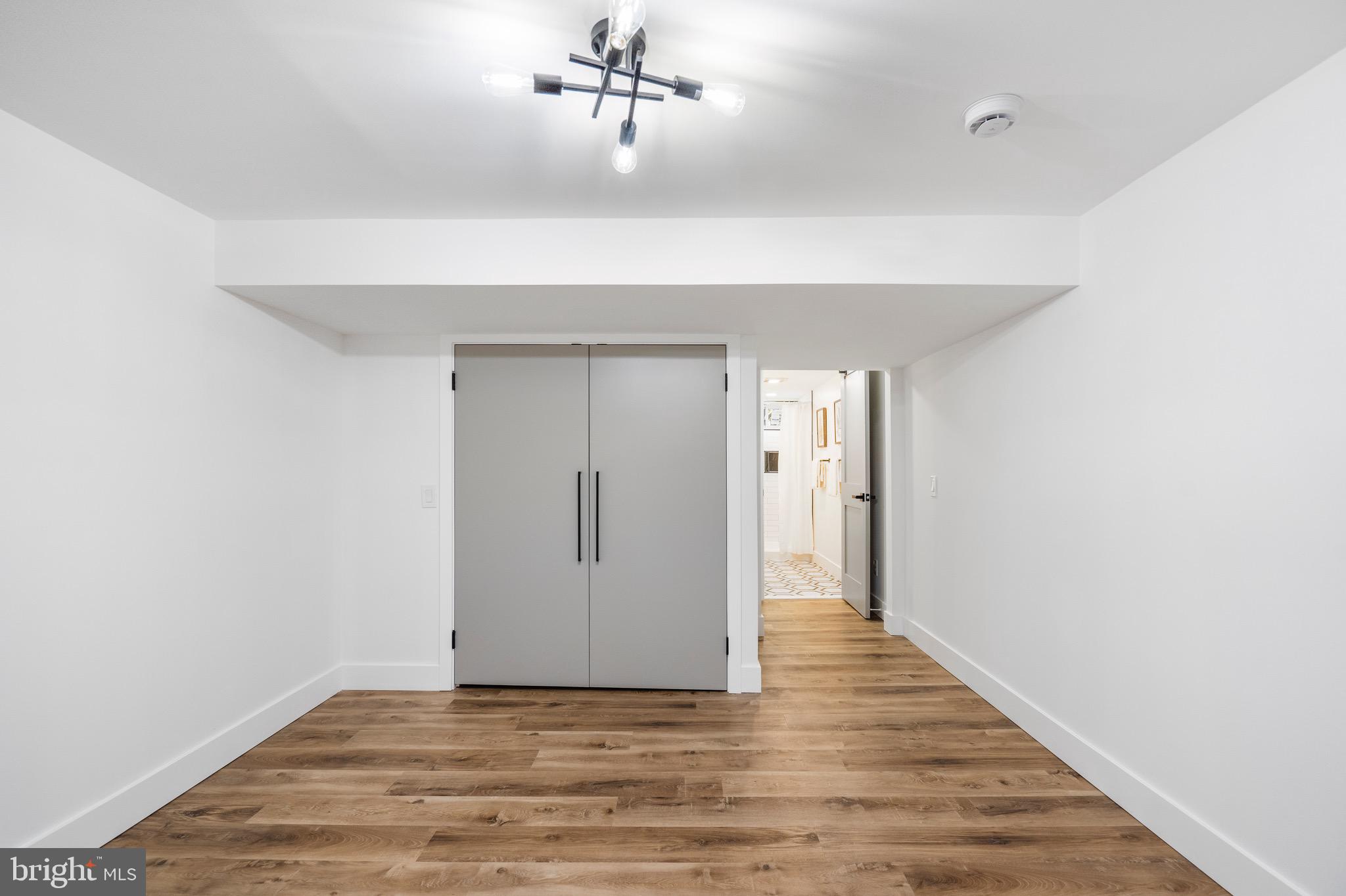 1808 Winford Road Baltimore, MD 21239 - Photo 36 of 39 a view of a room with wooden floor