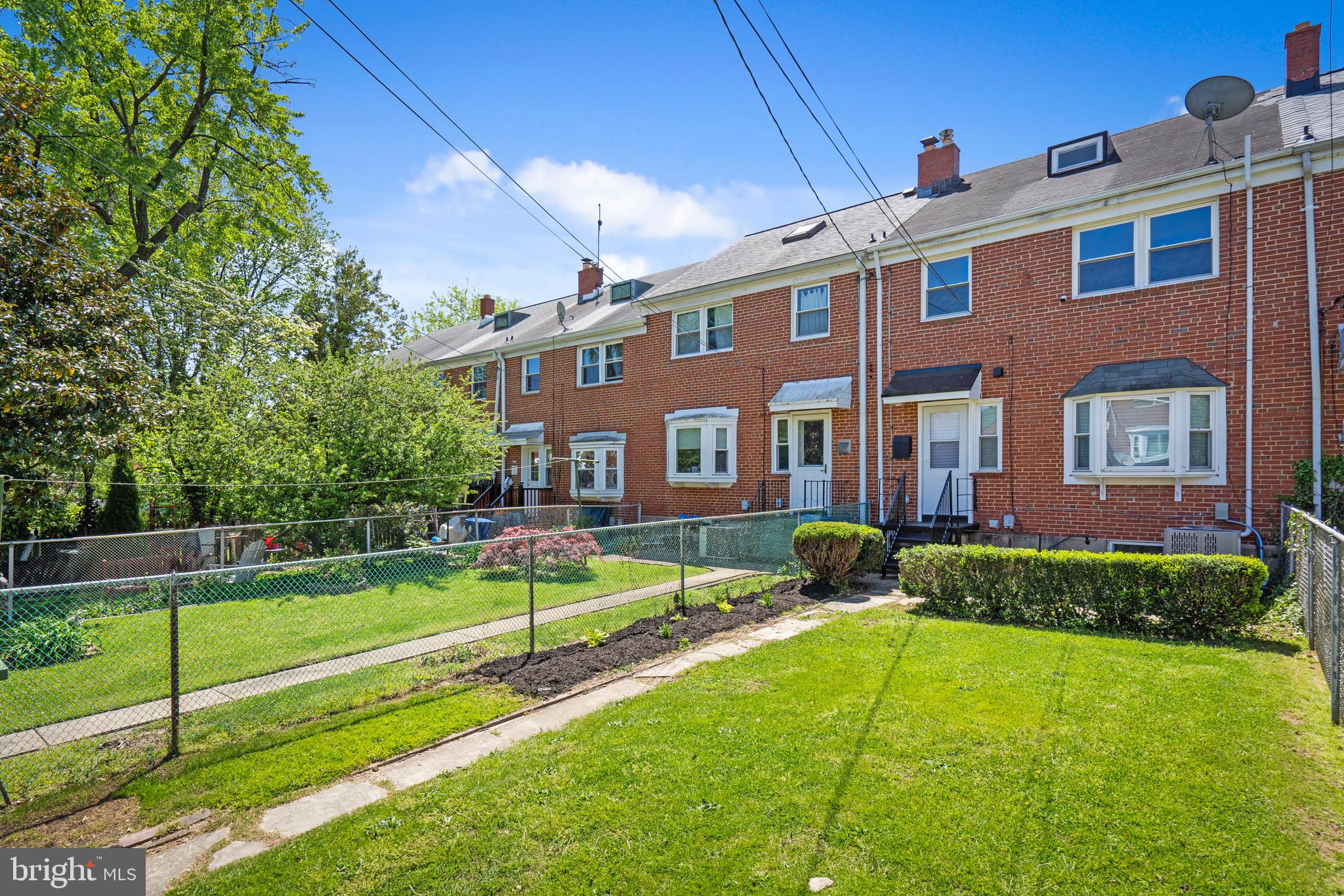 1808 Winford Road Baltimore, MD 21239 - Photo 38 of 39 a front view of a house with a yard