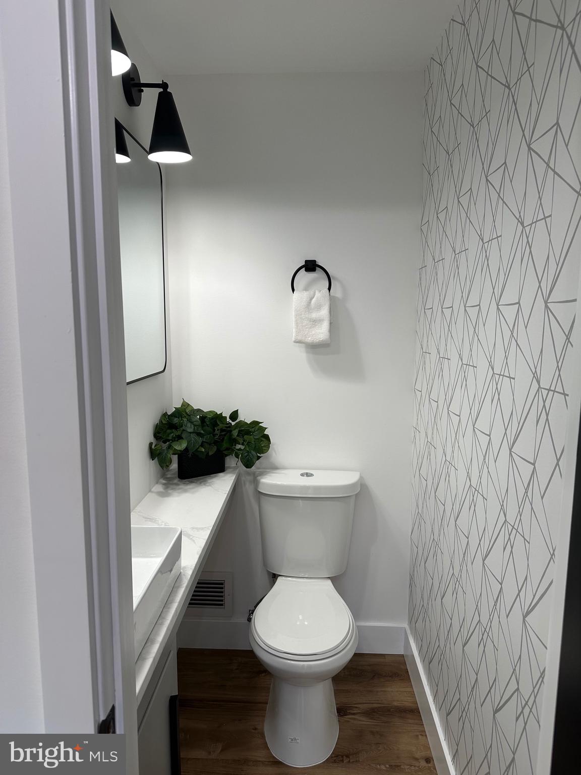 1808 Winford Road Baltimore, MD 21239 - Photo 6 of 39 a white toilet sitting next to a shower curtain