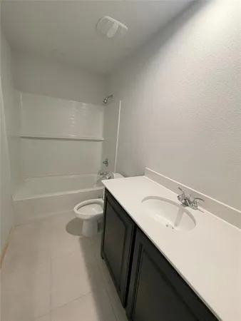 a kitchen with a sink and a stove top oven
