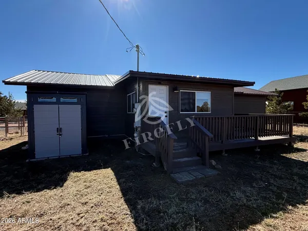 a view of house with backyard