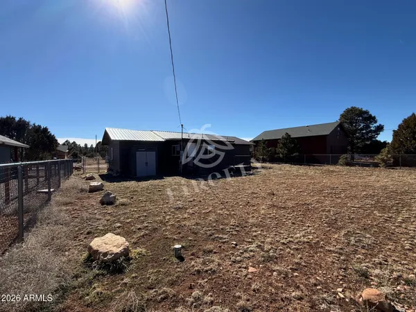 a view of a backyard of the house