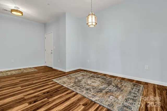a bedroom with a bed and a large window with outer view
