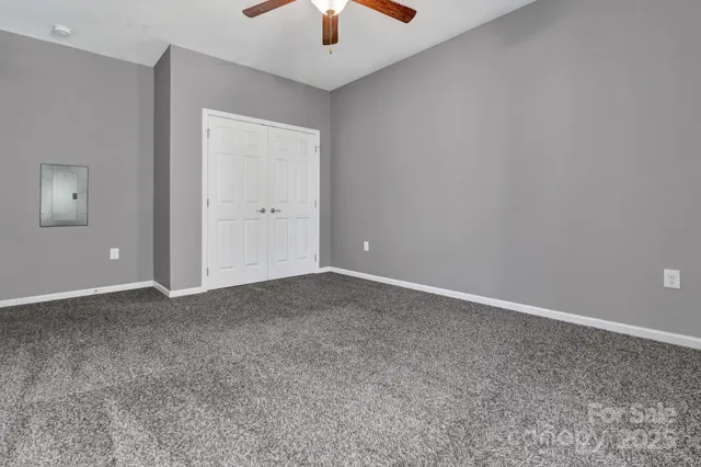 a swimming pool with outdoor seating and yard