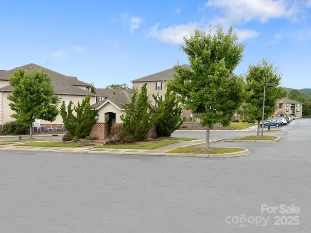 a view of a backyard with sitting area