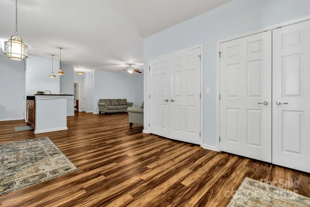 a bedroom with a bed and a dresser in it