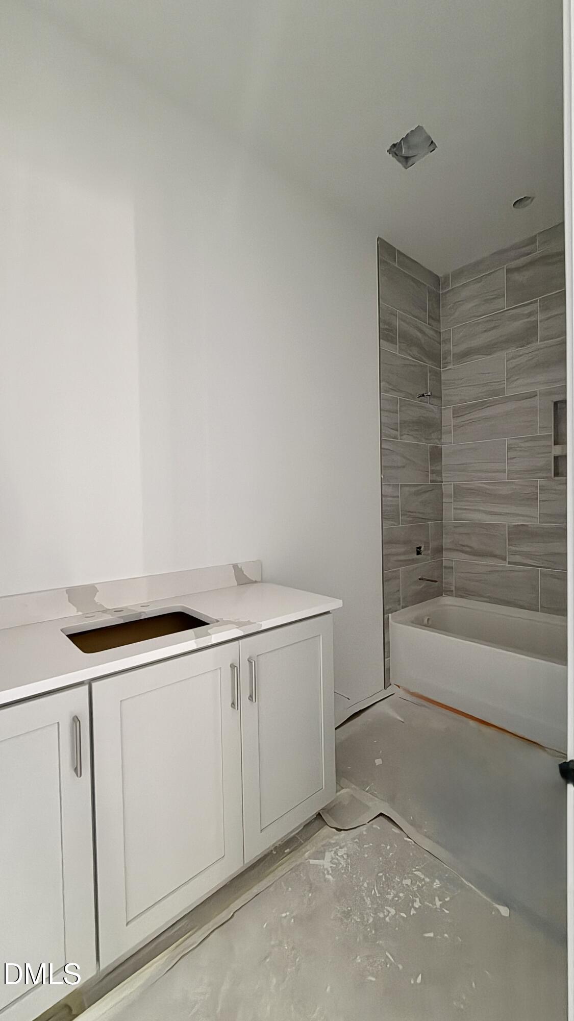 2232 Abbeyhill Drive, Unit 107 Raleigh, NC 27610 - Photo 12 of 26 a utility room with cabinets