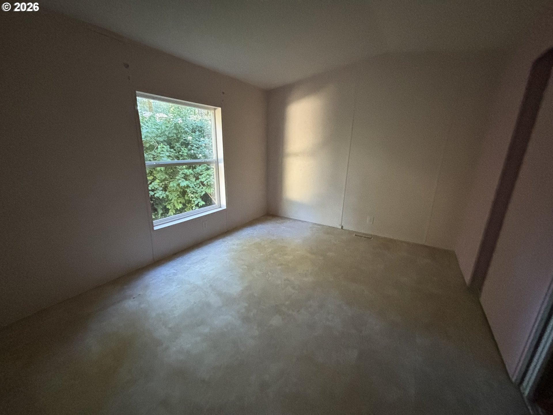 64 Outer Drive Florence, OR 97439 - Photo 3 of 8 an empty room with windows