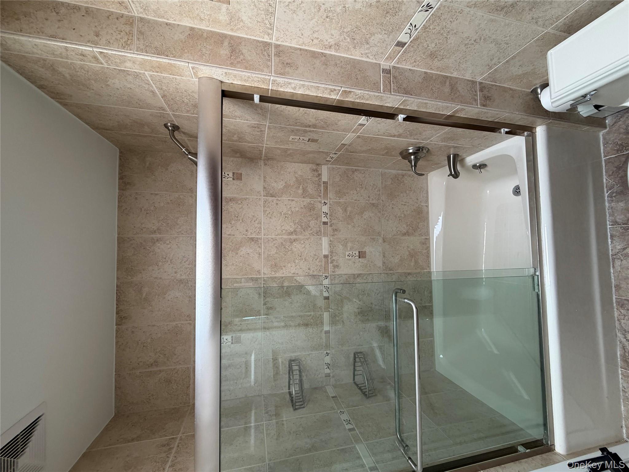 144-50 25th Road Queens, NY 11354 - Photo 9 of 20 a bathroom with a shower and toilet