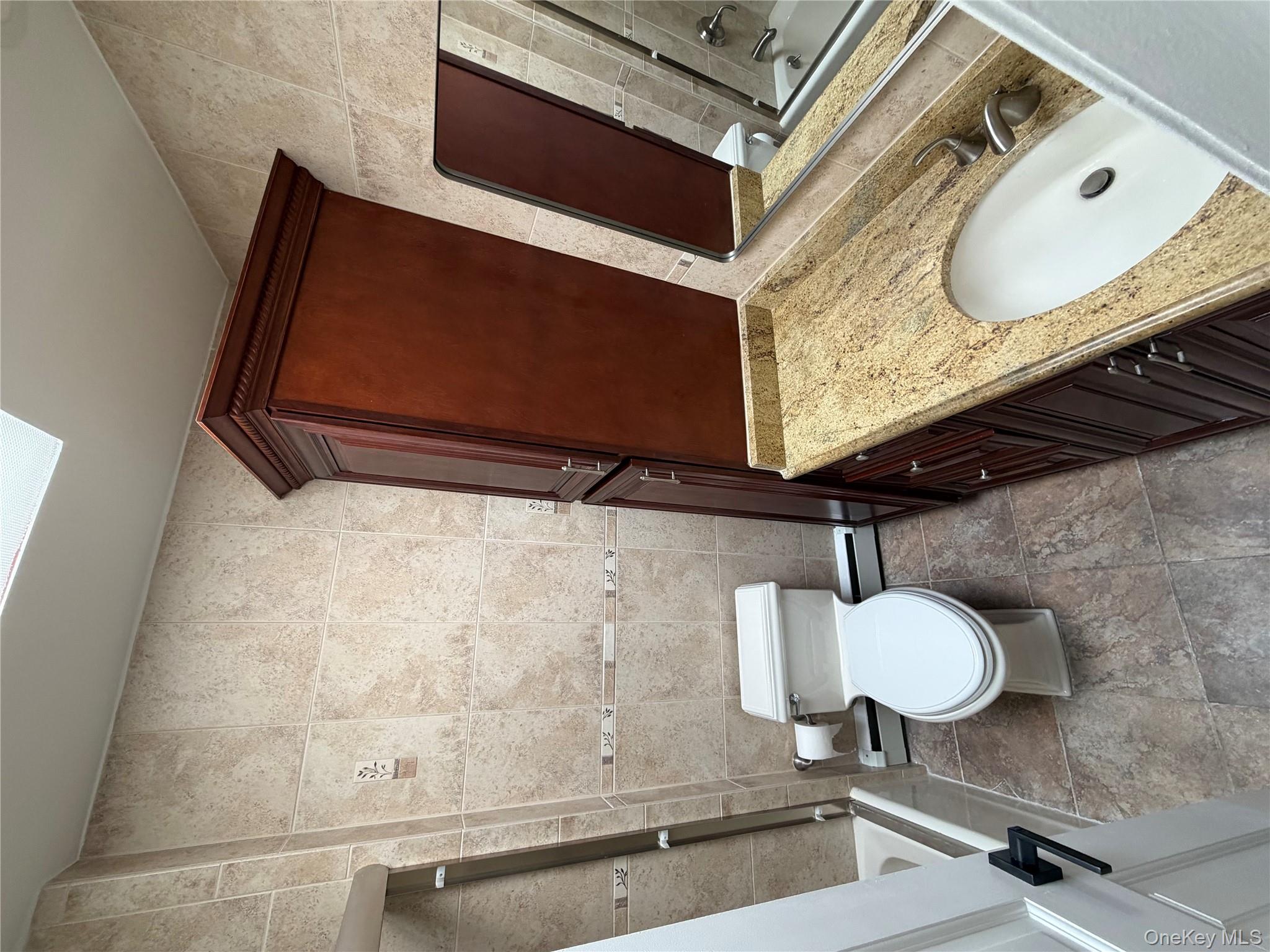 144-50 25th Road Queens, NY 11354 - Photo 10 of 20 a bathroom with a sink toilet and shower