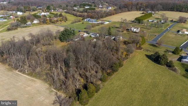 a aerial view of residential houses with outdoor space