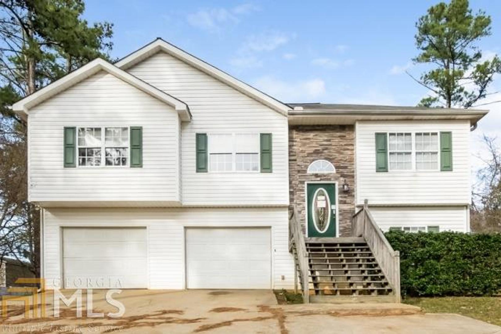 130 Fairfield Road Villa Rica, GA 30180 - Photo 1 of 1 a front view of a house with a garden