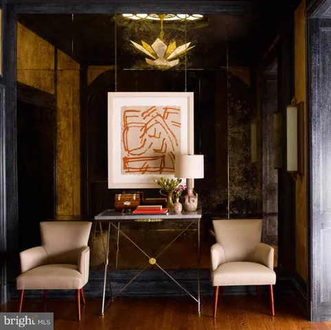 a living room with a couch and a potted plant