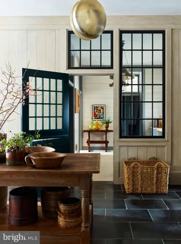 a kitchen with stainless steel appliances granite countertop a sink and a wooden cabinets