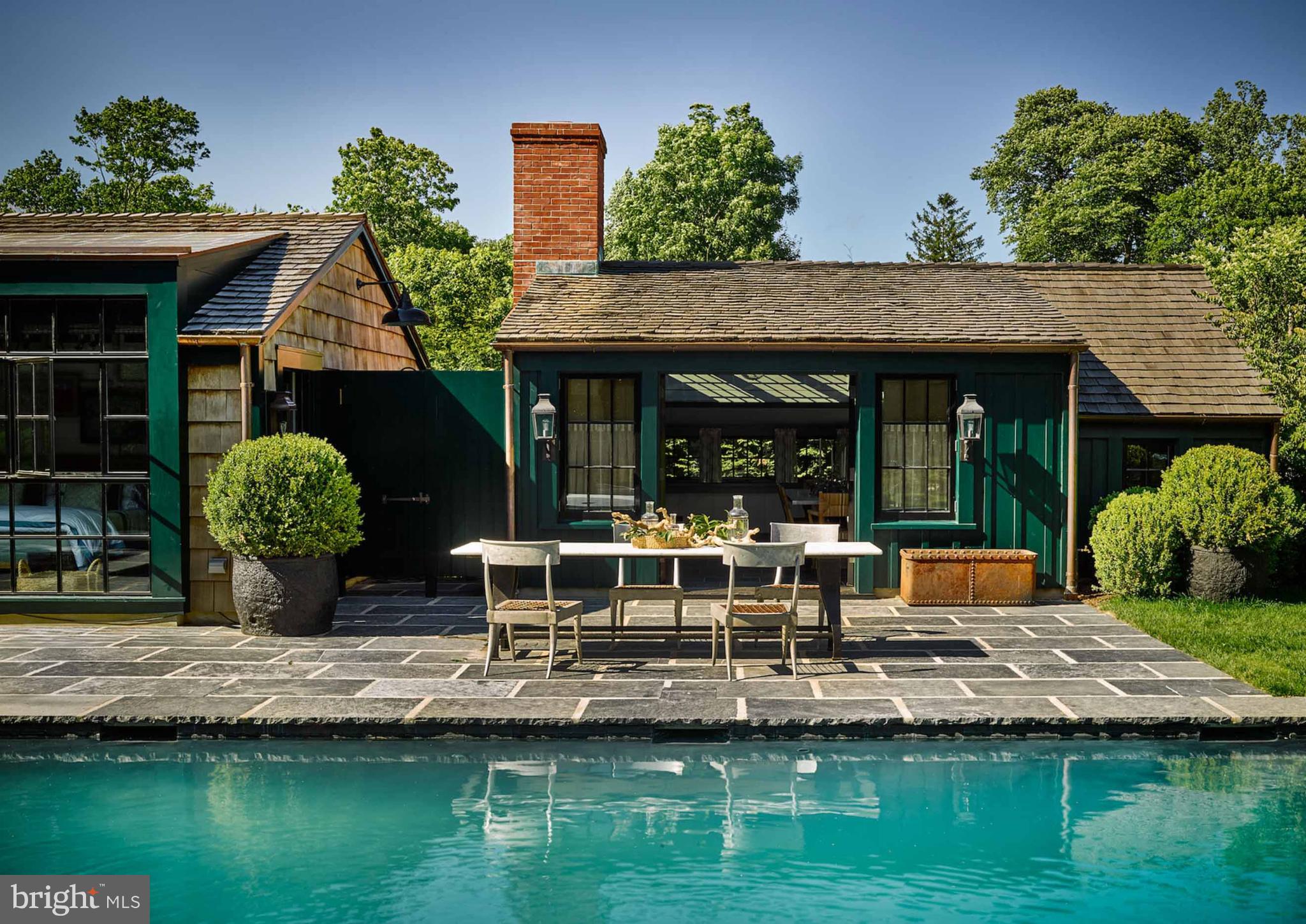 933 Hillside Road Lutherville-Timonium, MD 21093 - Photo 15 of 57 a view of house with garden space and swimming pool