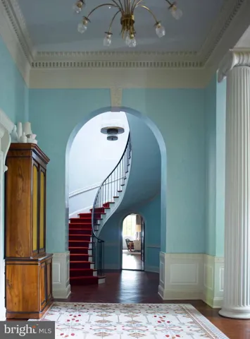 a view of a kitchen with wooden floor and breakfast area