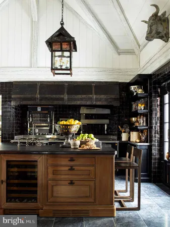 a view of entryway with kitchen island dining table and chairs