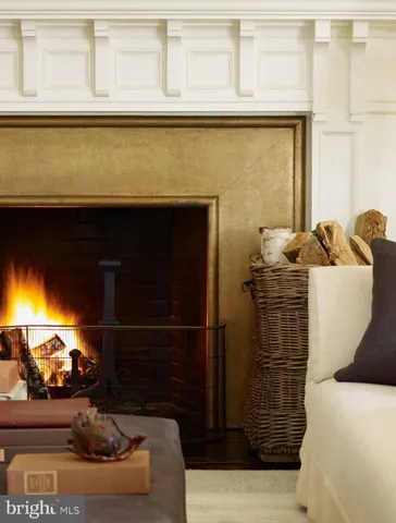 a bedroom with a bed and a fireplace