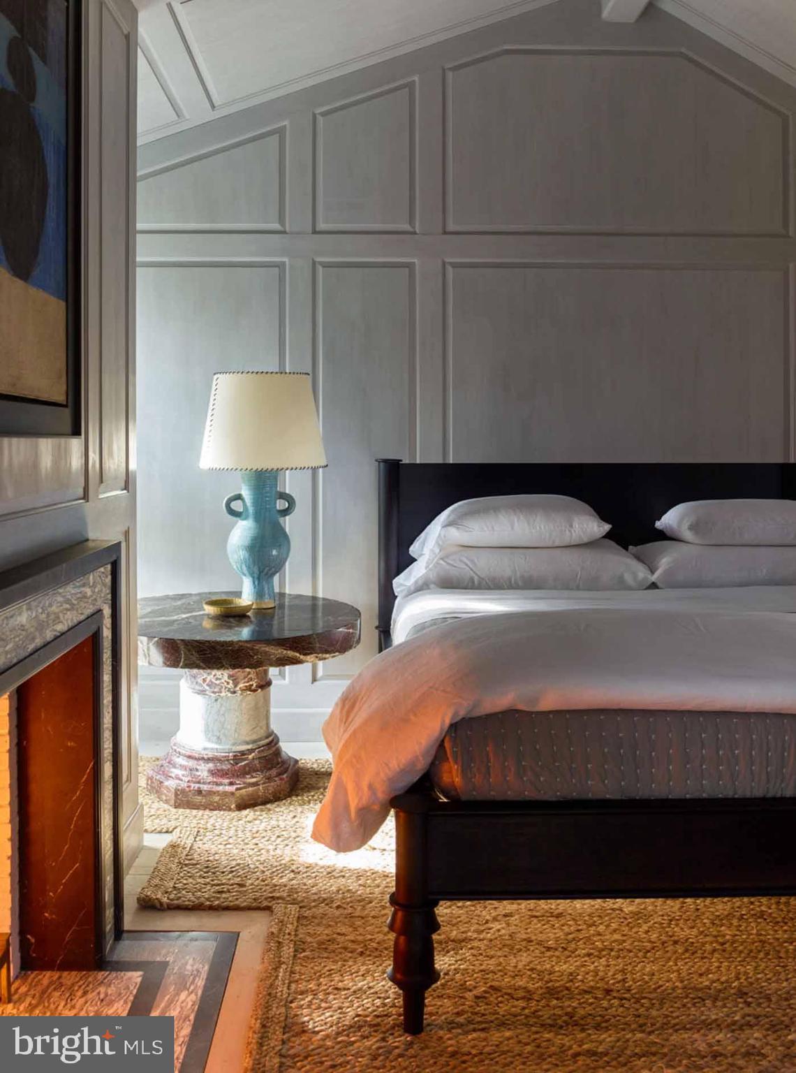 933 Hillside Road Lutherville-Timonium, MD 21093 - Photo 42 of 57 a bedroom with a bed and a fireplace