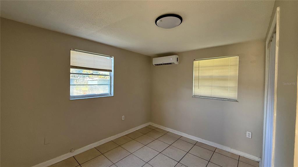 1314 North Combee Road, Unit 4 Lakeland, FL 33801 - Photo 7 of 12 an empty room with windows