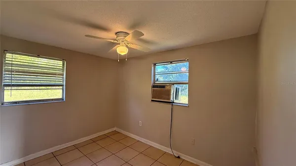a view of empty room with windows