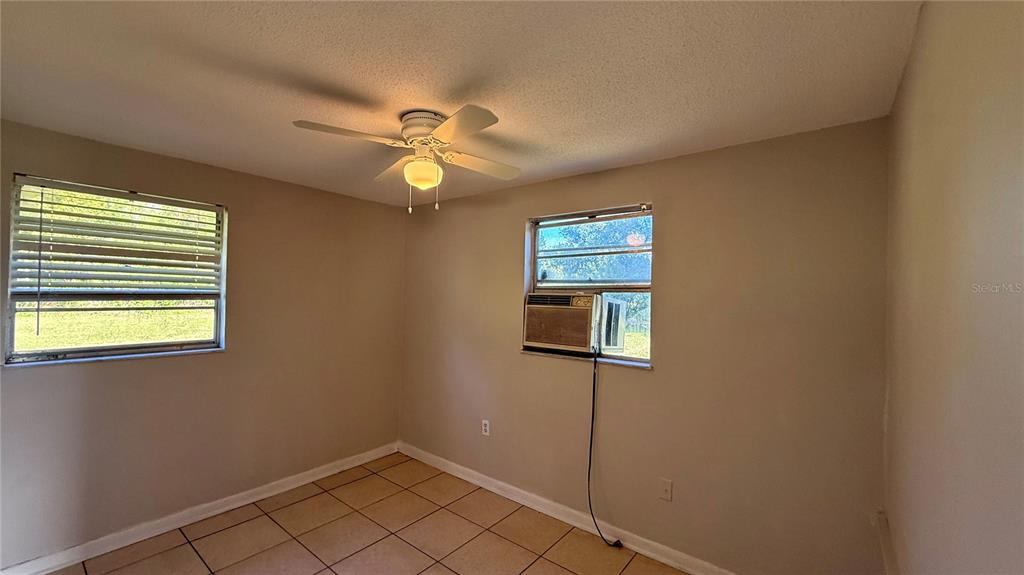 1314 North Combee Road, Unit 4 Lakeland, FL 33801 - Photo 8 of 12 a view of empty room with windows