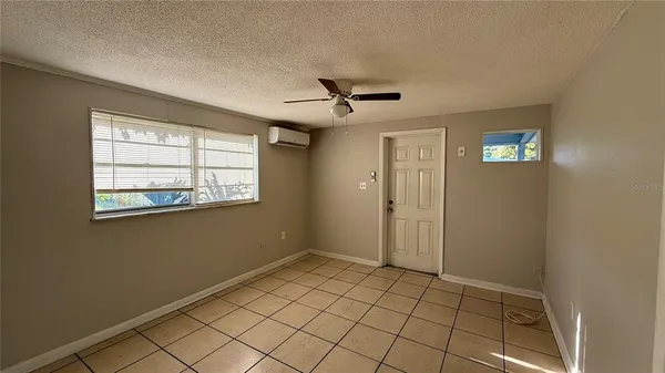 a view of an empty room and window